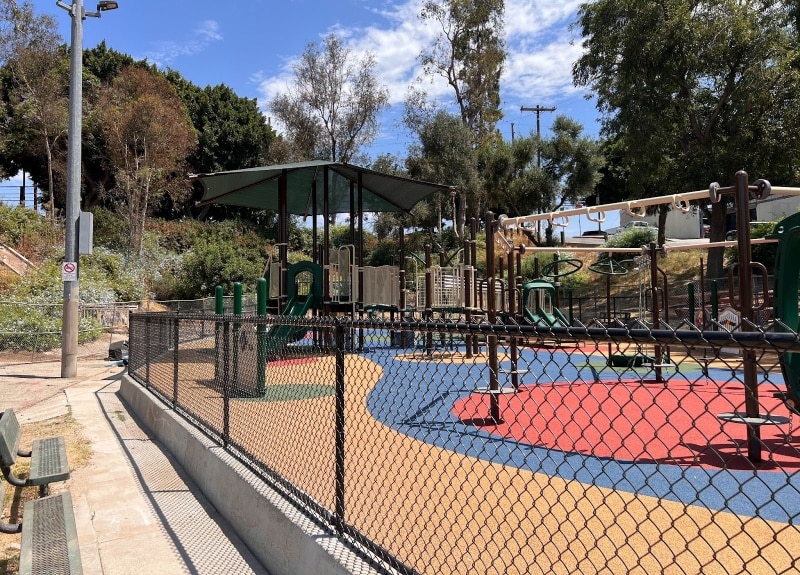A local park play area enclosed by our black chain-link fencing near Ojai, California.