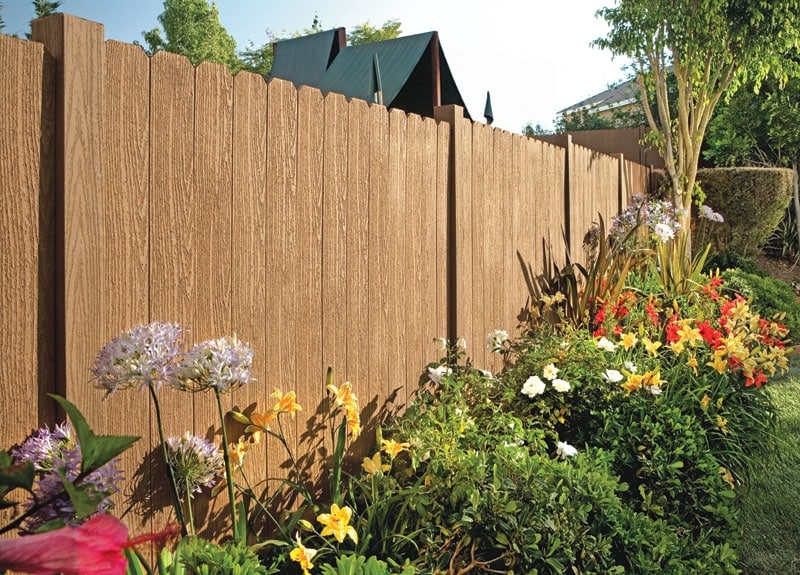 A beautiful North Ranch, Westlake Village wood privacy fence in front of an assortment of plants.