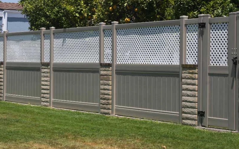 Somis custom vinyl fences and gates with stone columns.