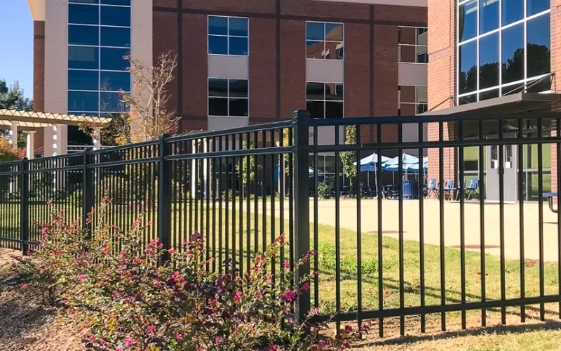 Black ornamental iron fencing around the perimeter of a business, installed by our Lobo Canyon, Agoura Hills commercial fence and gate company.