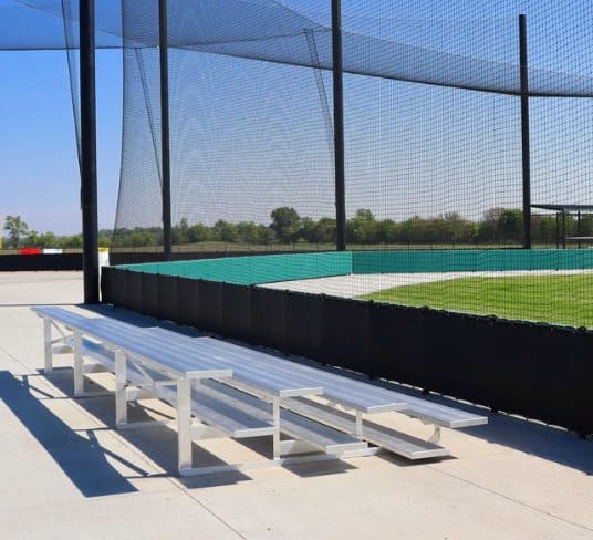 Bleachers beside a batting cage