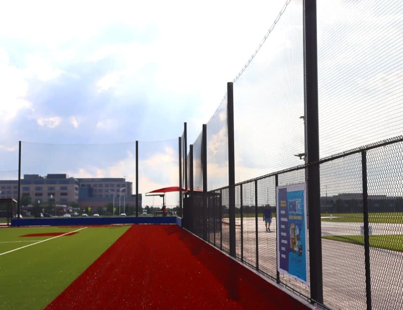 Perimeter barrier netting along a walkway