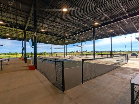 Perimeter netting around indoor courts