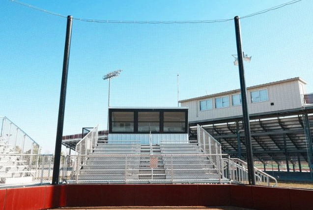 Elevated press box above bleachers